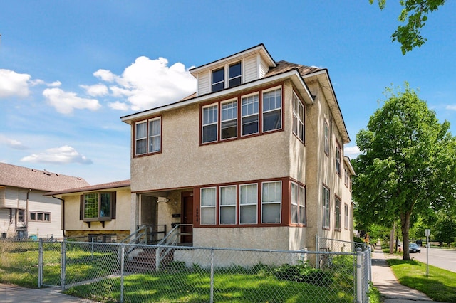 1264 Snelling Ave N, Saint Paul, MN 55108 - view of front facade featuring stucco siding and a gate