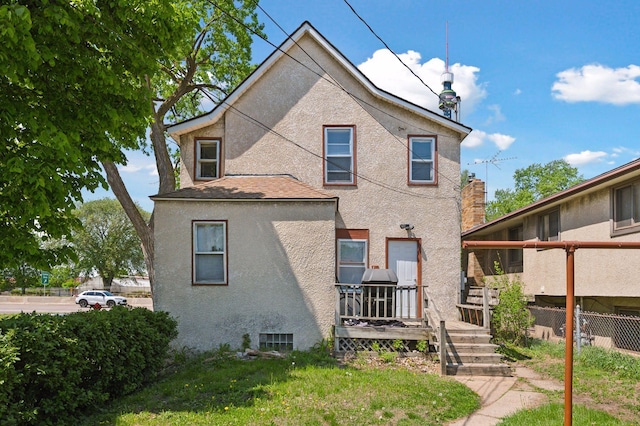 1264 Snelling Ave N, Saint Paul, MN 55108 - rear view of house with stucco siding
