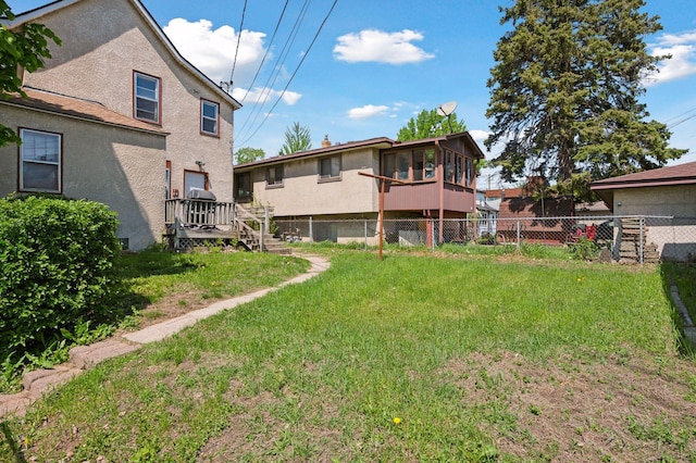 1264 Snelling Ave N, Saint Paul, MN 55108 - rear view of house featuring stairs, stucco siding, and a sunroom