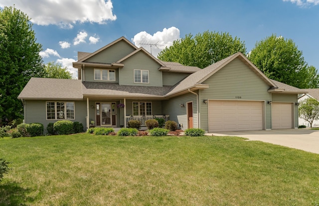 traditional home with a garage, a porch, concrete driveway, a front yard, and roof with shingles