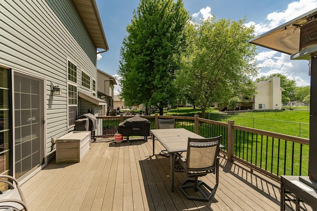 wooden terrace featuring outdoor dining space