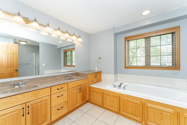 full bath featuring tile patterned floors, a bath, double vanity, and a shower with door