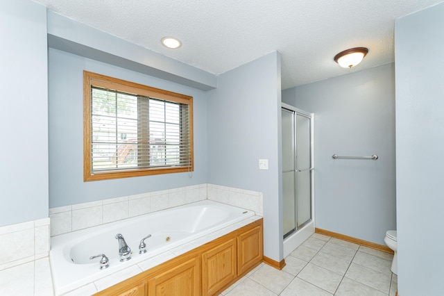 bathroom featuring toilet, a stall shower, tile patterned flooring, a whirlpool tub, and a textured ceiling