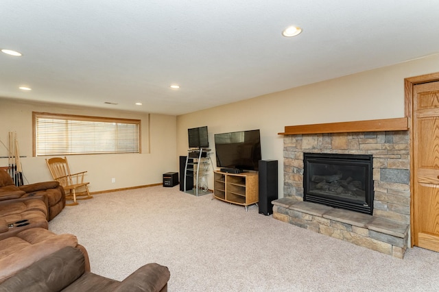carpeted living room featuring baseboards, a fireplace, and recessed lighting