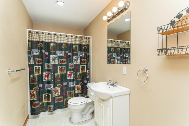full bath with toilet, curtained shower, vanity, and tile patterned flooring