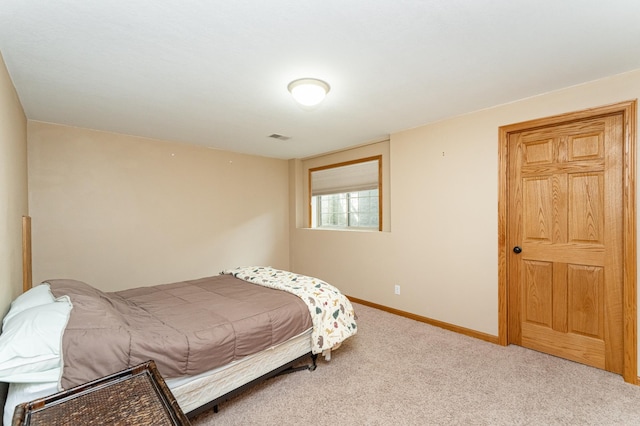 bedroom with carpet and baseboards