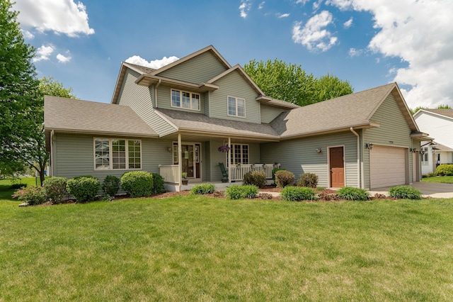traditional-style home with covered porch, a garage, a front lawn, concrete driveway, and a shingled roof