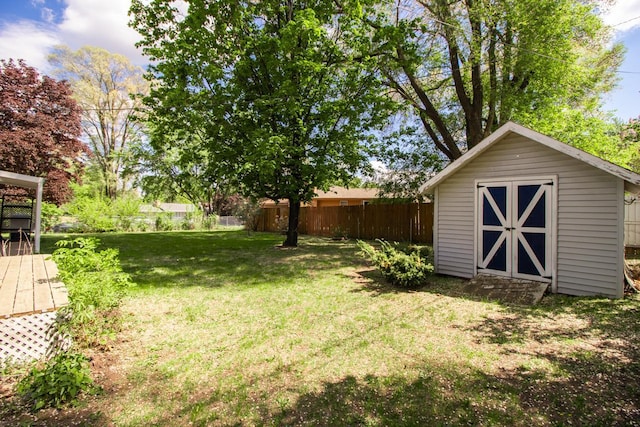 view of yard with a storage unit and an outbuilding