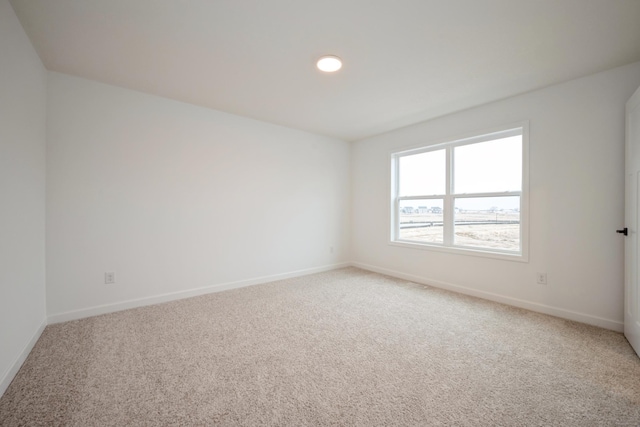 5713 Rathbun Way, Otsego, MN 55374 - spare room featuring light colored carpet, baseboards, and recessed lighting
