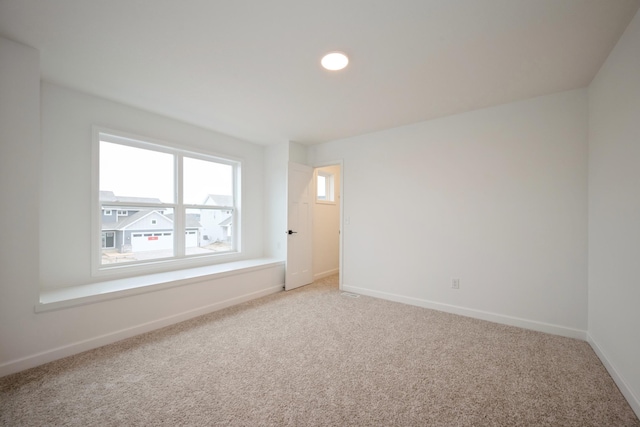 5713 Rathbun Way, Otsego, MN 55374 - spare room featuring light carpet, baseboards, and recessed lighting