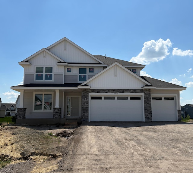 5713 Rathbun Way, Otsego, MN 55374 - craftsman inspired home with a garage, stone siding, covered porch, and driveway