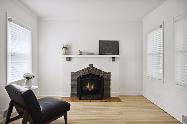 3937 Ewing Ave S, Minneapolis, MN 55410 - sitting room featuring crown molding, wood finished floors, and a fireplace