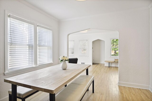 3937 Ewing Ave S, Minneapolis, MN 55410 - dining room with arched walkways, ornamental molding, and light wood finished floors