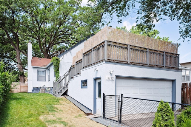 3937 Ewing Ave S, Minneapolis, MN 55410 - view of front facade with stucco siding, stairway, and a balcony