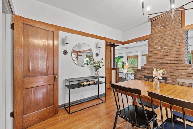 dining room with stairs and light wood-type flooring