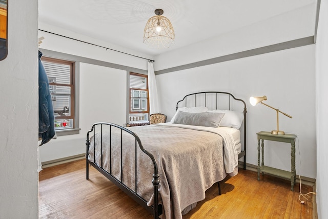 bedroom with hardwood / wood-style floors