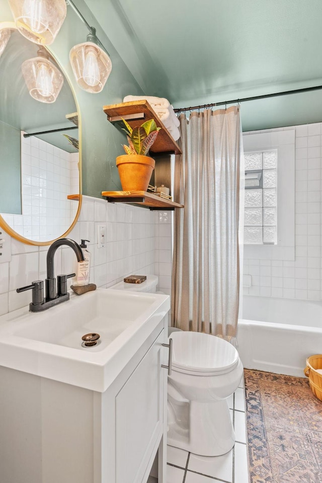 bathroom featuring vanity, toilet, tile patterned flooring, backsplash, and shower / tub combo