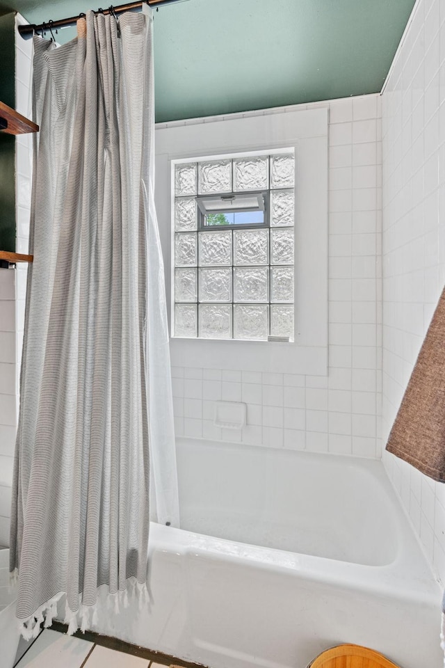 bathroom with shower / bath combination with curtain