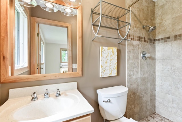 2270 Manning Trl N, Lake Elmo, MN 55042 - bathroom featuring a tile shower, toilet, and vanity