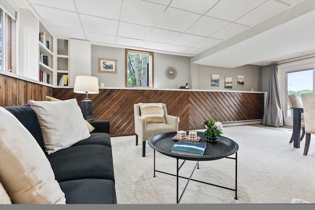 2270 Manning Trl N, Lake Elmo, MN 55042 - carpeted living room with wooden walls, a wainscoted wall, built in shelves, and a paneled ceiling
