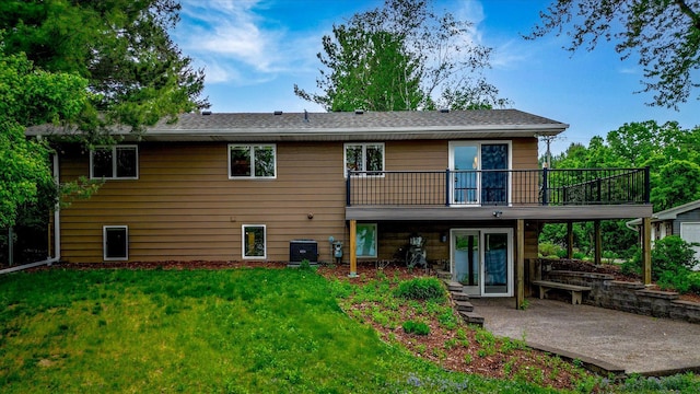 2270 Manning Trl N, Lake Elmo, MN 55042 - rear view of house featuring a lawn, a patio, a wooden deck, and central AC