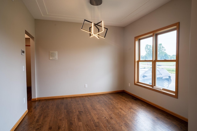 13320 Cedar Ave, Apple Valley, MN 55124 - empty room featuring dark wood-style flooring and a chandelier