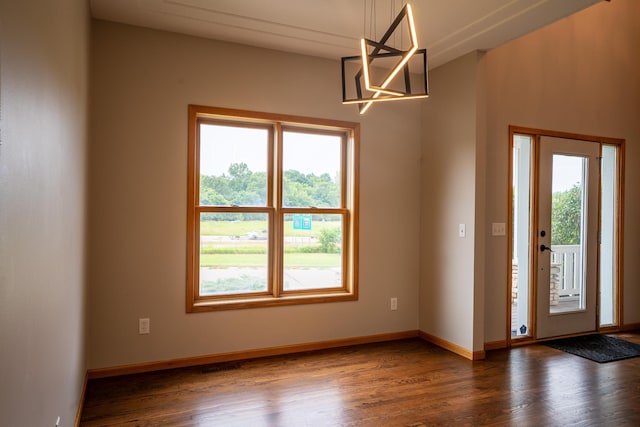 13320 Cedar Ave, Apple Valley, MN 55124 - entryway with healthy amount of natural light, dark wood-style floors, and a chandelier