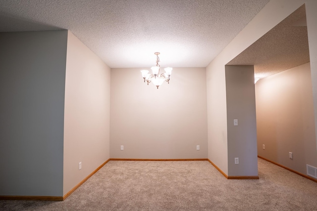 13320 Cedar Ave, Apple Valley, MN 55124 - carpeted spare room featuring a chandelier and a textured ceiling