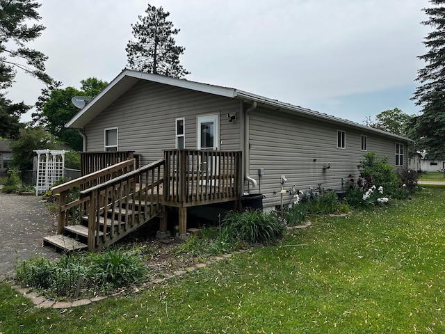 326 5th St NE, Crosby, MN 56441 - rear view of house featuring a yard and a deck