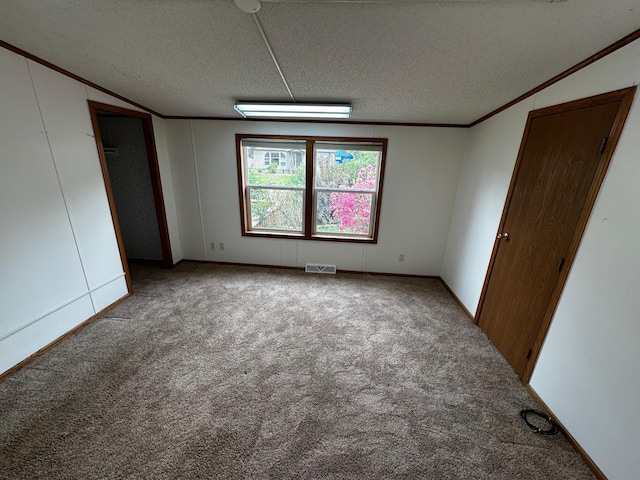 326 5th St NE, Crosby, MN 56441 - unfurnished bedroom featuring crown molding, carpet flooring, and a textured ceiling