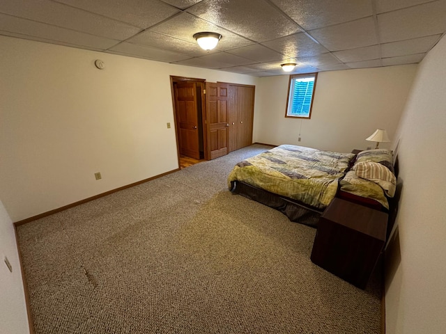 326 5th St NE, Crosby, MN 56441 - carpeted bedroom with a paneled ceiling and baseboards