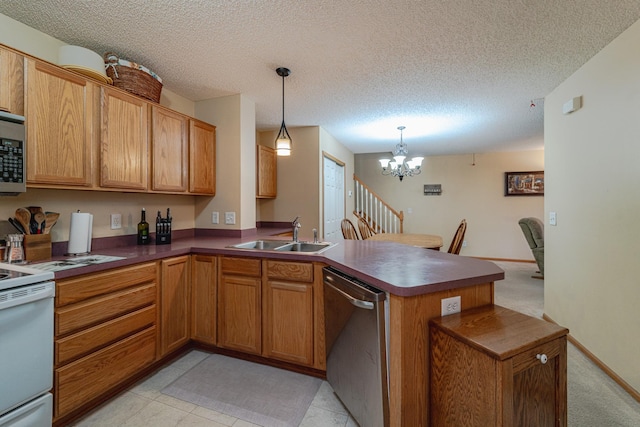17366 River Birch Ln, Prior Lake, MN 55372 - kitchen with appliances with stainless steel finishes, a sink, a peninsula, a chandelier, and a textured ceiling