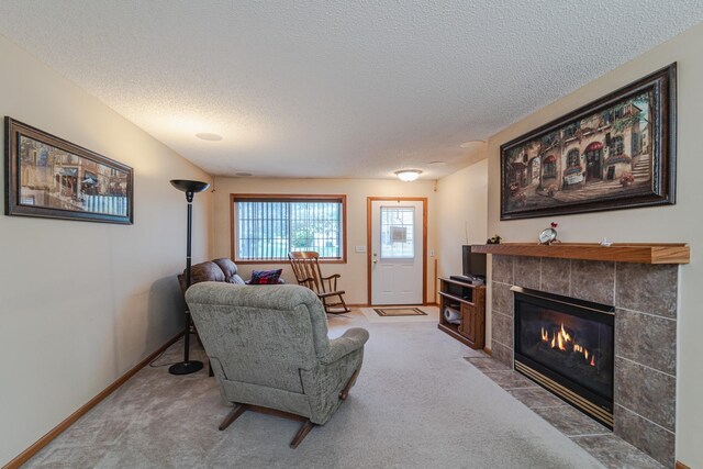 17366 River Birch Ln, Prior Lake, MN 55372 - carpeted living area with a textured ceiling, a tile fireplace, and baseboards