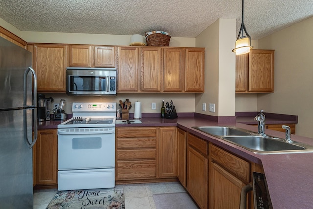 17366 River Birch Ln, Prior Lake, MN 55372 - kitchen featuring stainless steel microwave, white range with electric cooktop, freestanding refrigerator, a sink, and brown cabinets