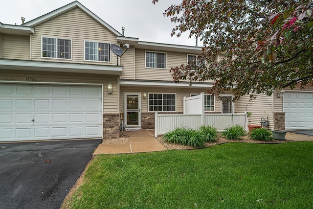 17366 River Birch Ln, Prior Lake, MN 55372 - view of front facade featuring a front yard, asphalt driveway, and brick siding