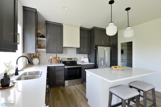 1182 Jill Dr W, West Fargo, ND 58078 - kitchen with stainless steel appliances, open shelves, a sink, tasteful backsplash, and light countertops