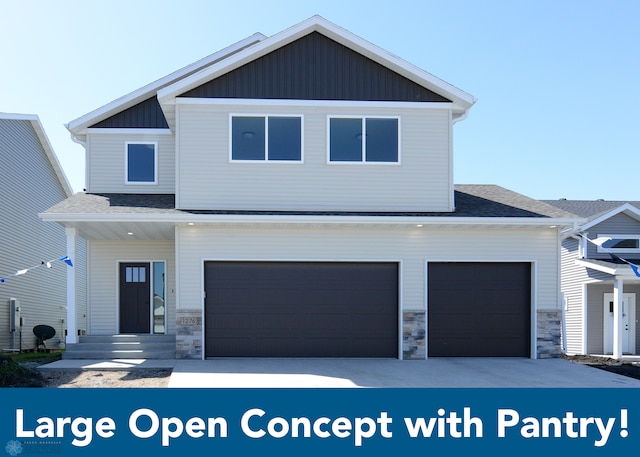 1182 Jill Dr W, West Fargo, ND 58078 - view of front of property with stone siding, a garage, and a shingled roof