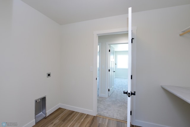 1182 Jill Dr W, West Fargo, ND 58078 - washroom featuring hookup for an electric dryer, wood finished floors, and baseboards