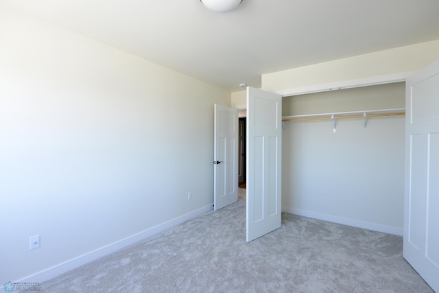 1182 Jill Dr W, West Fargo, ND 58078 - unfurnished bedroom with light carpet, a closet, and baseboards