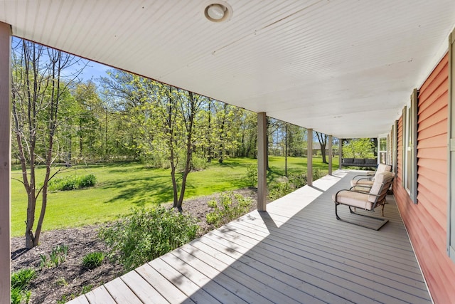 deck featuring a lawn