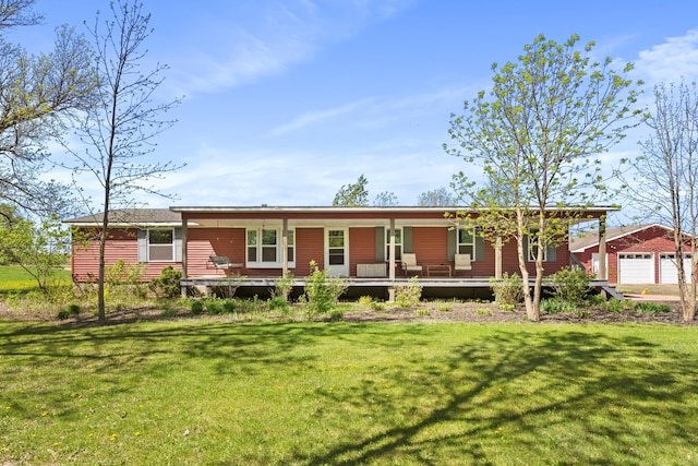 view of front of house featuring covered porch and a front yard