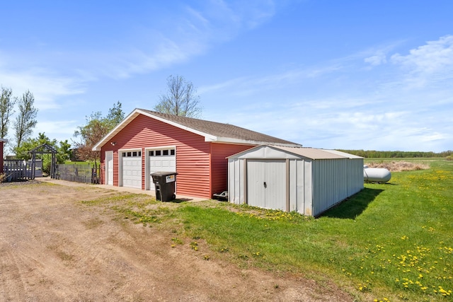detached garage with a storage shed