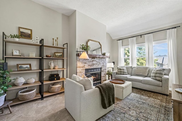 1715 Livingston Ave Unit A, West Saint Paul, MN 55118 - living room with vaulted ceiling, a stone fireplace, a textured ceiling, and carpet floors