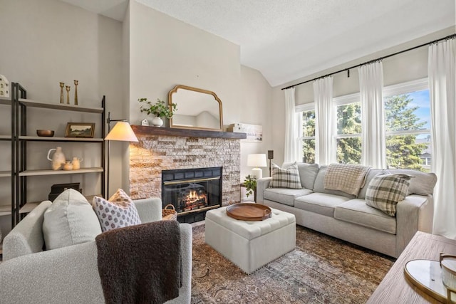 1715 Livingston Ave Unit A, West Saint Paul, MN 55118 - living area featuring vaulted ceiling and a stone fireplace