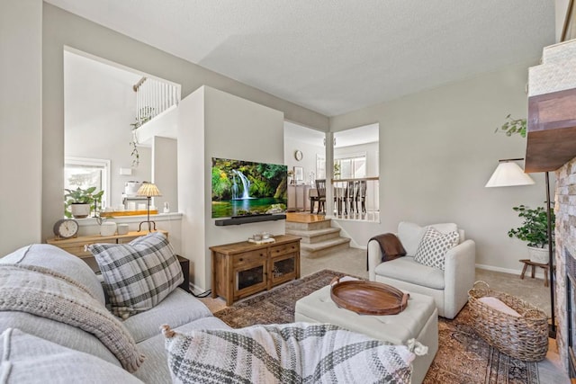 1715 Livingston Ave Unit A, West Saint Paul, MN 55118 - carpeted living room with stairway, healthy amount of natural light, a textured ceiling, and baseboards