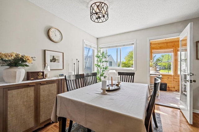 1715 Livingston Ave Unit A, West Saint Paul, MN 55118 - dining area featuring a textured ceiling