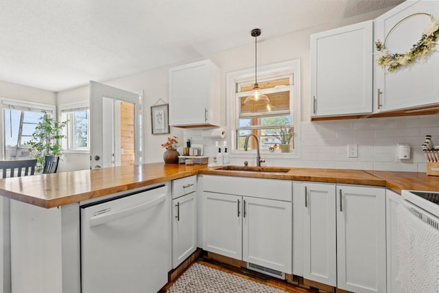 1715 Livingston Ave Unit A, West Saint Paul, MN 55118 - kitchen featuring wood counters, dishwasher, a peninsula, a sink, and plenty of natural light