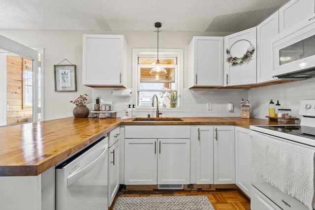1715 Livingston Ave Unit A, West Saint Paul, MN 55118 - kitchen with wooden counters, white appliances, a sink, a peninsula, and a textured ceiling
