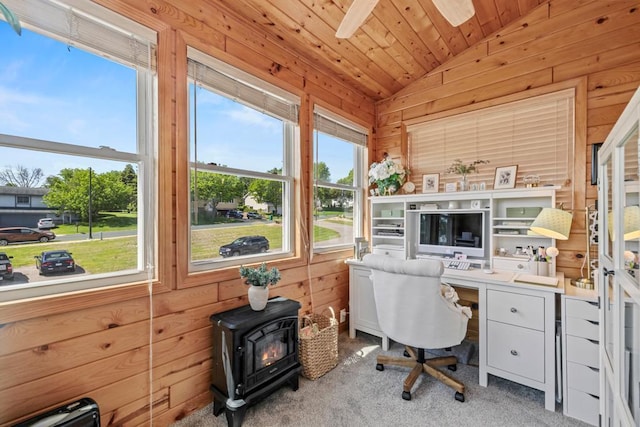 1715 Livingston Ave Unit A, West Saint Paul, MN 55118 - carpeted home office featuring vaulted ceiling, a wood stove, wood walls, wood ceiling, and a ceiling fan