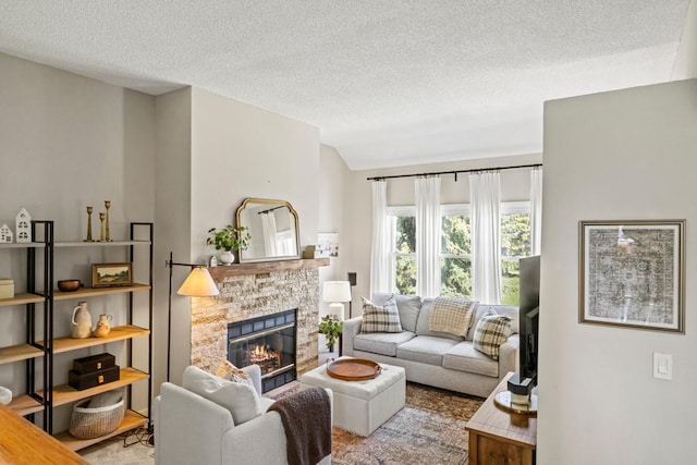 1715 Livingston Ave Unit A, West Saint Paul, MN 55118 - living room with a fireplace, a textured ceiling, and lofted ceiling
